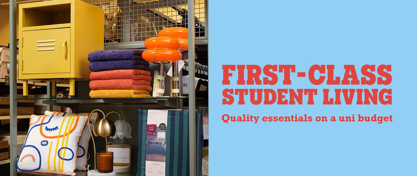 Store shelf with yellow storage locker, towels, lamps, cushions and bedding